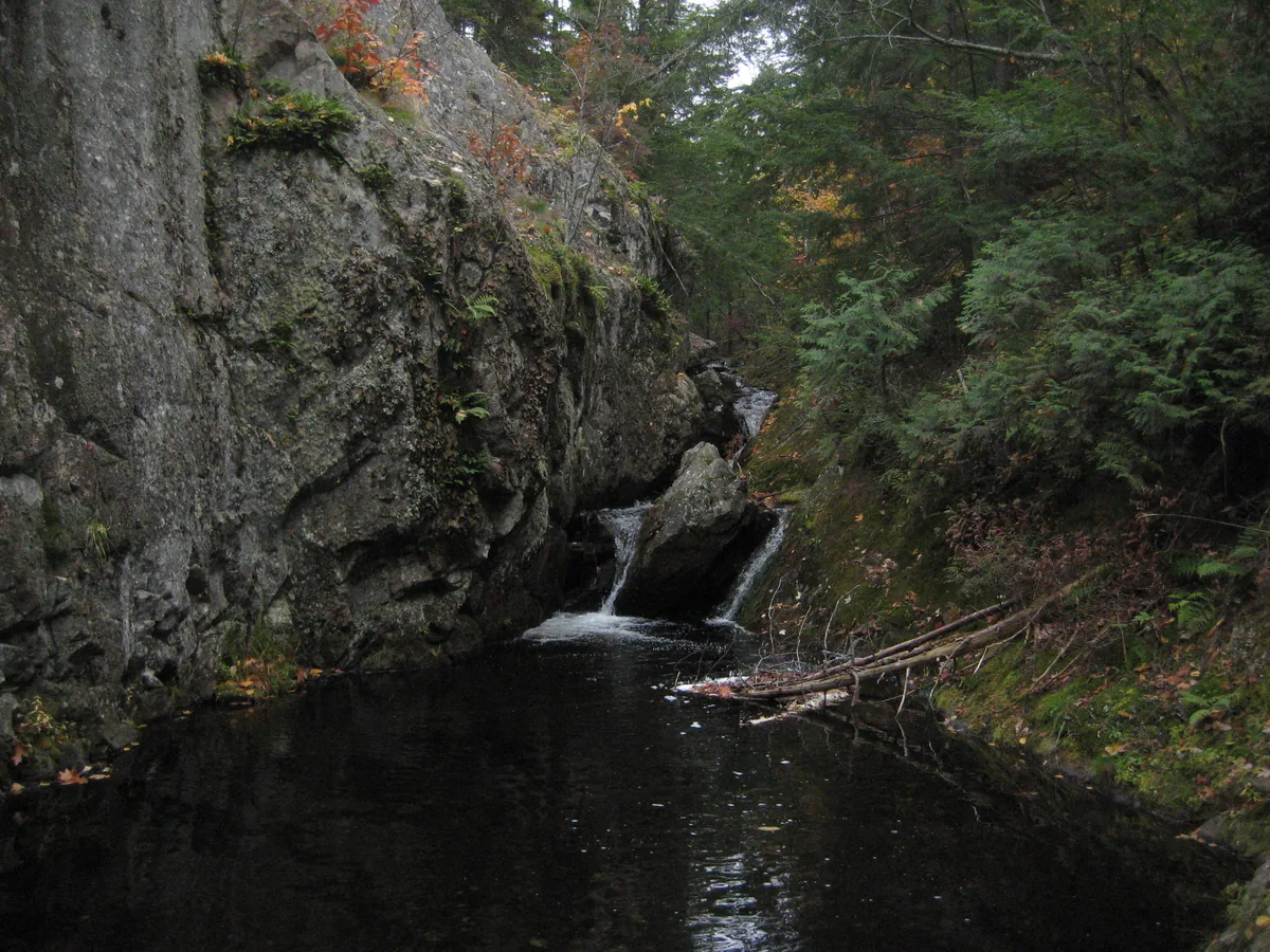 Small drop into a deep, dark pool