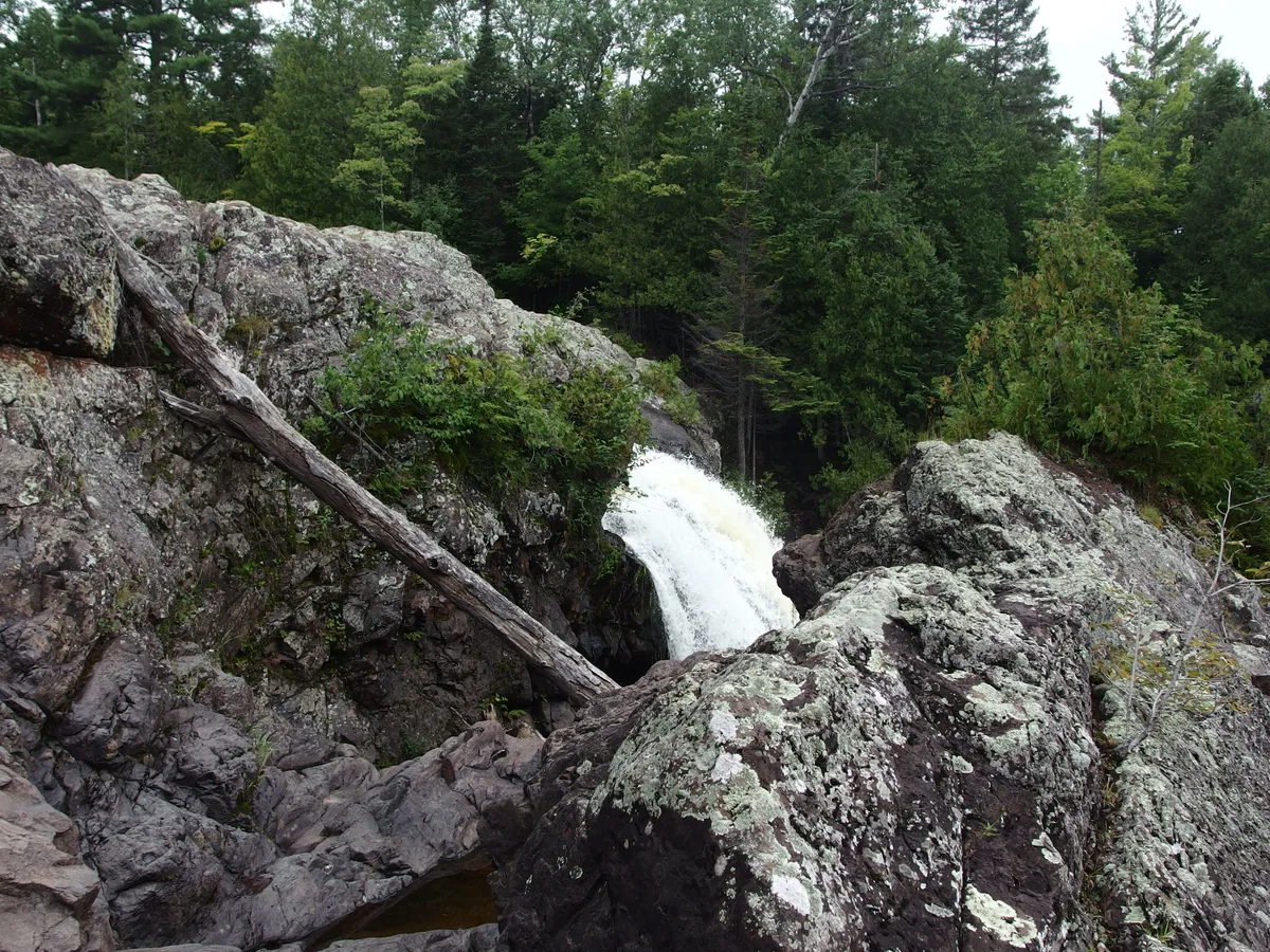 Steep rock formations around the falls