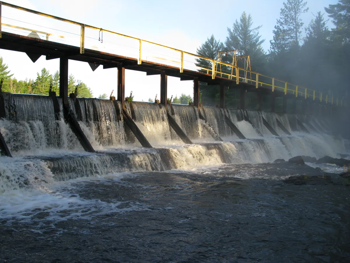 Water cascading neatly over the dam