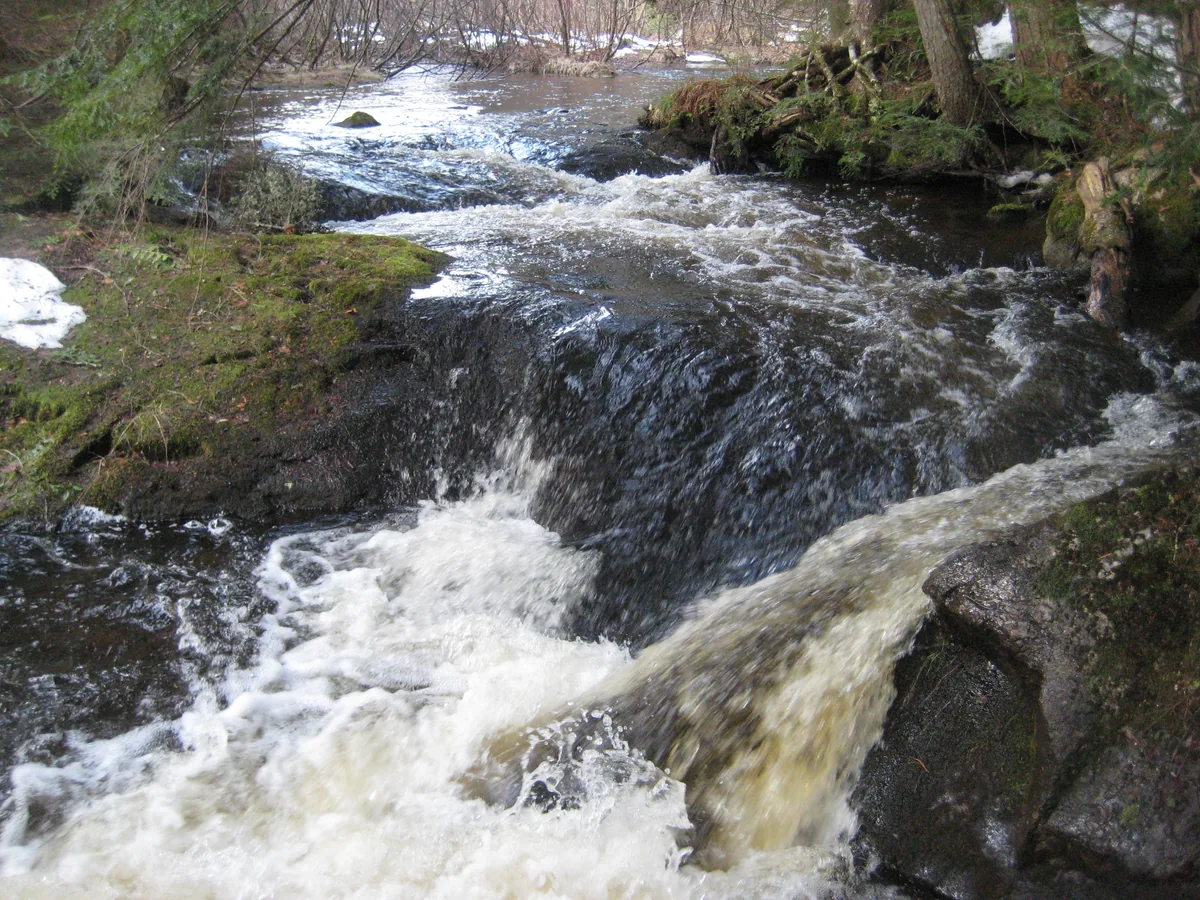 Smooth waters dropping over smooth rocks