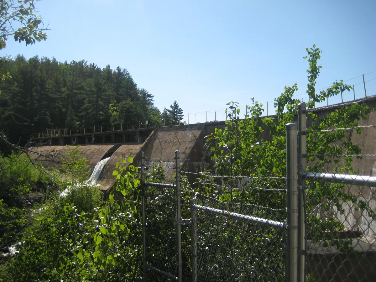 Larger dam and small distant falls