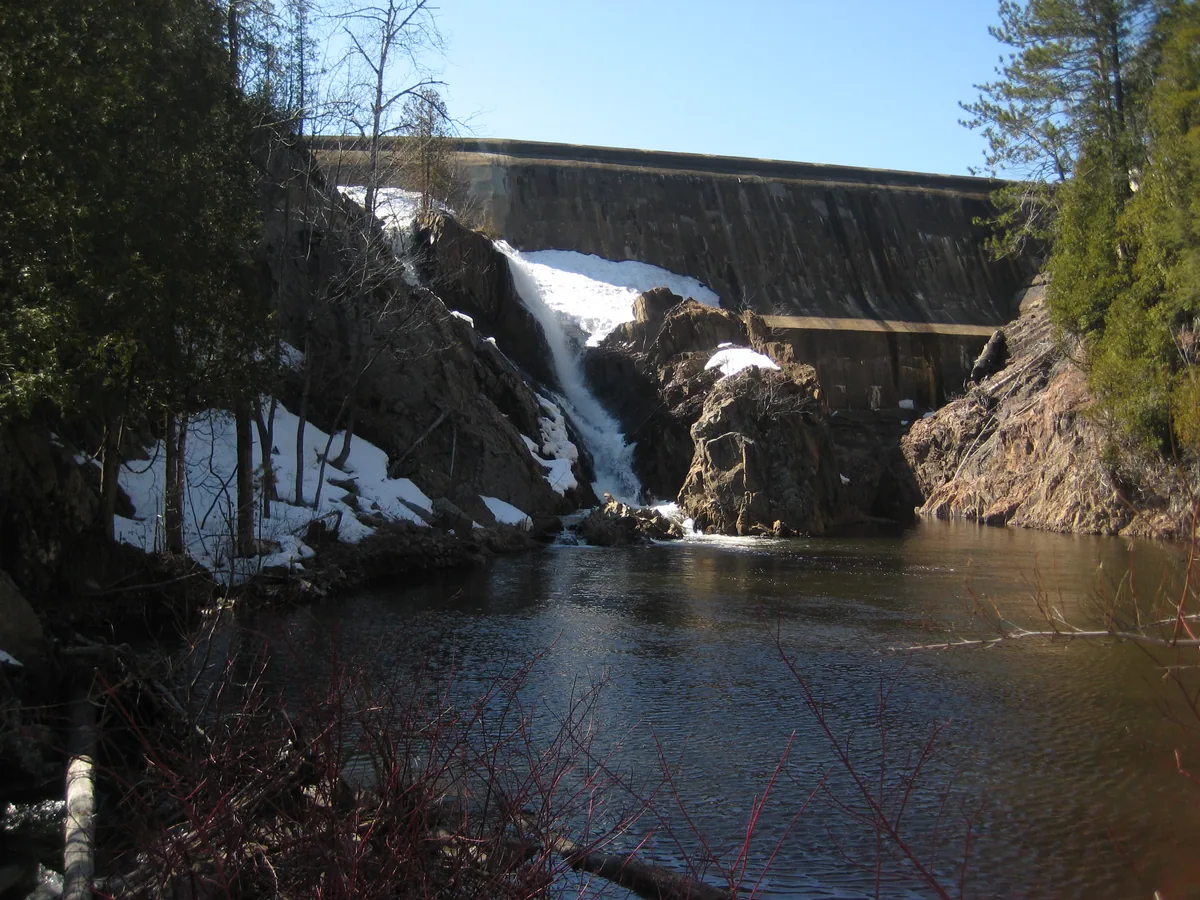 Towering dam above the river