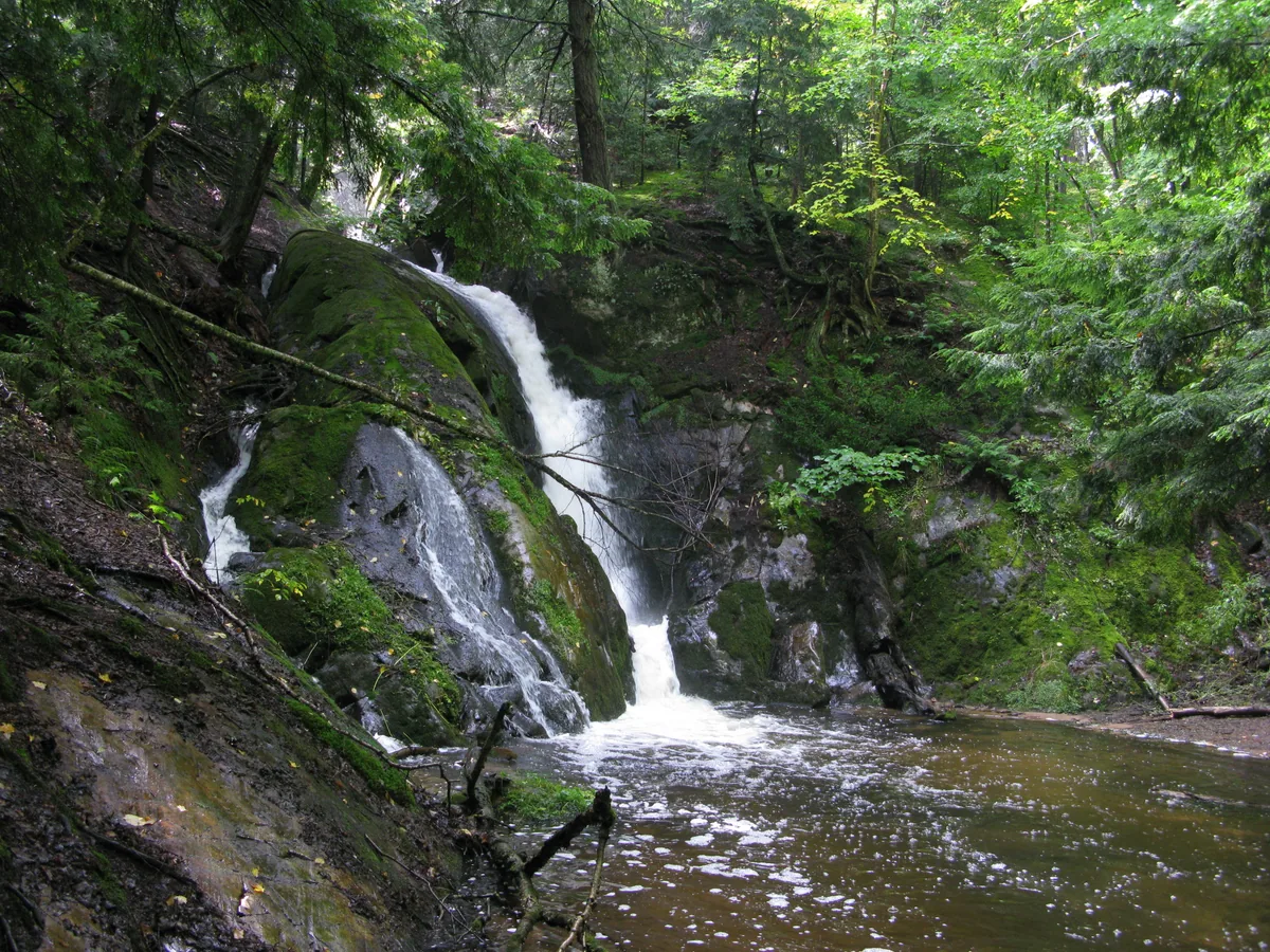 Looking up the massive waterfall