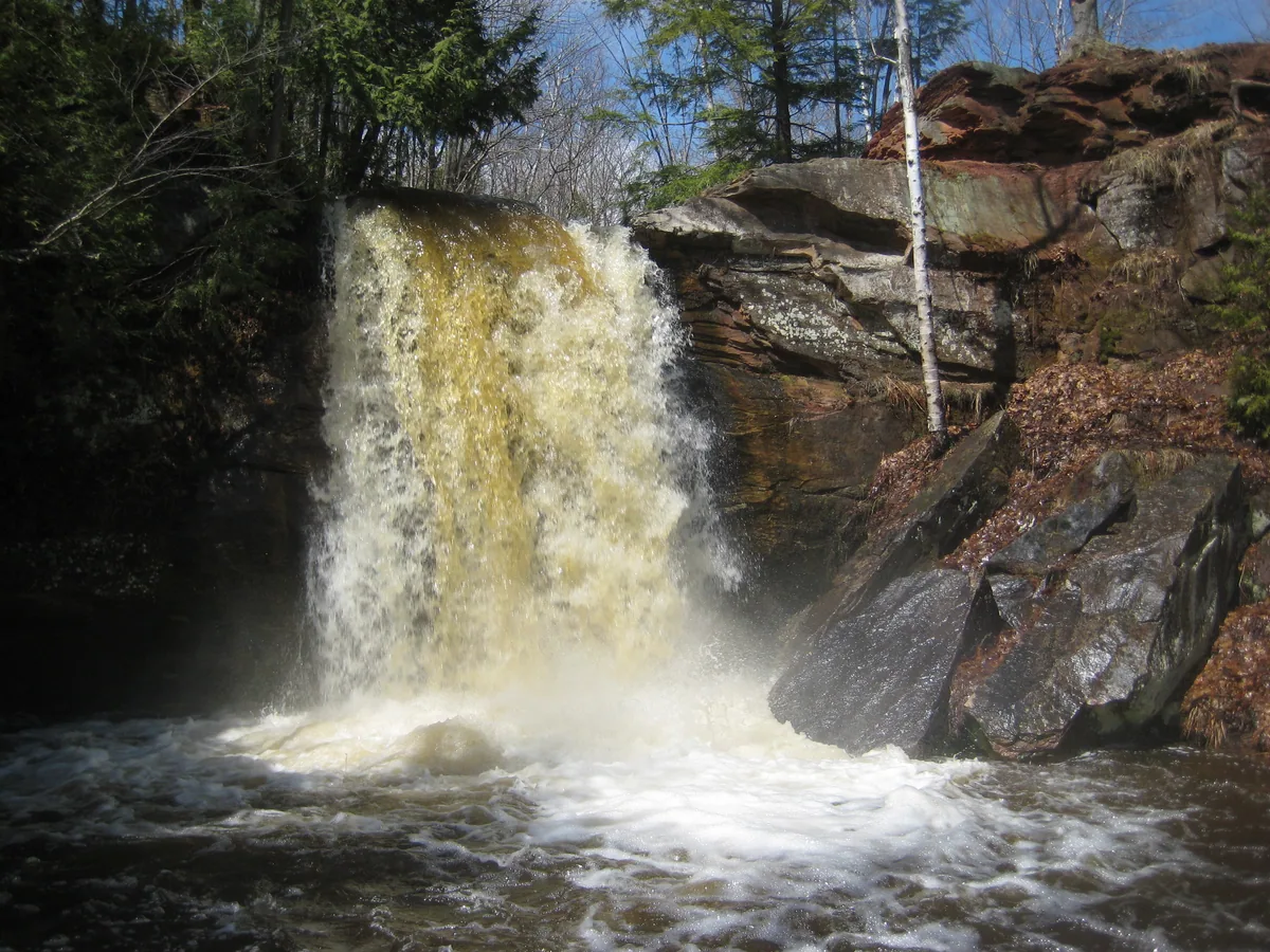 Brown curtain plunging down the bowl
