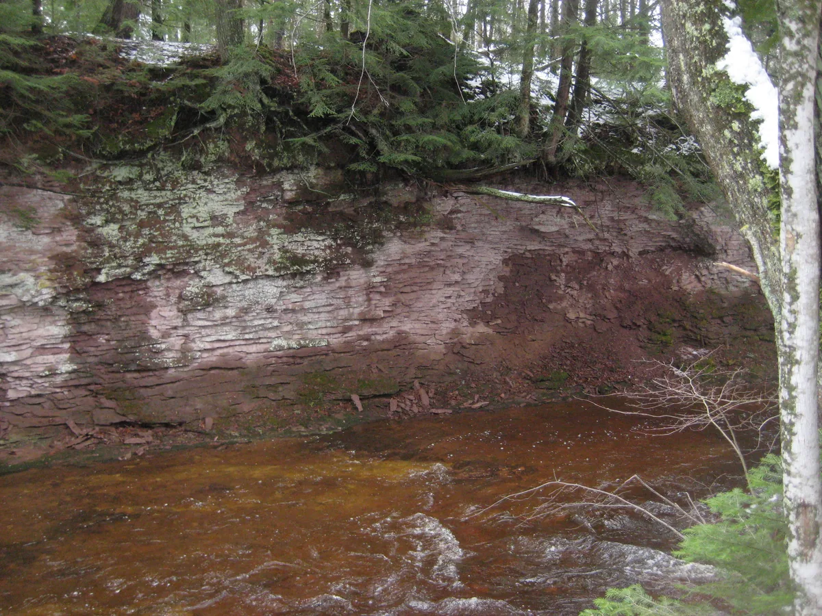 Steep sandstone banks over Little Garlic River
