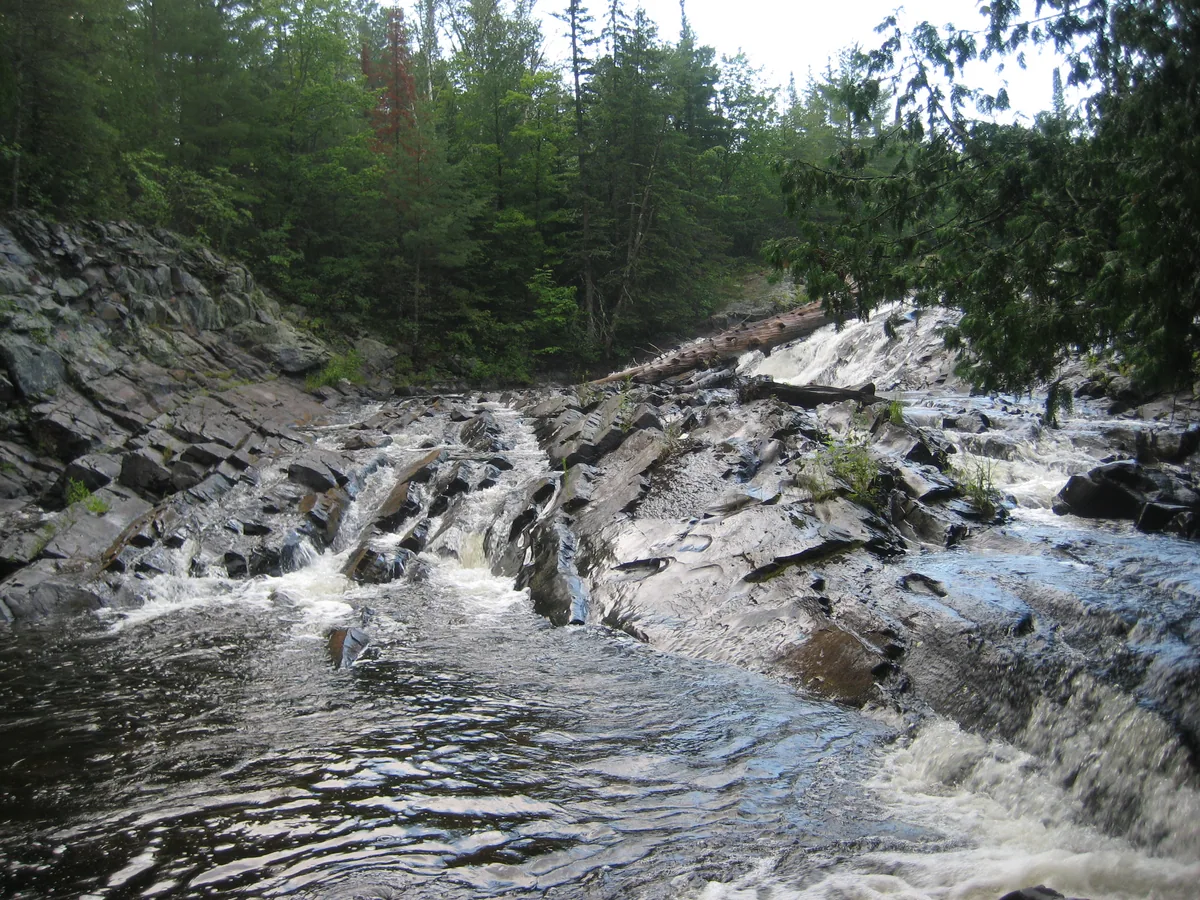 Peeking around to the falls
