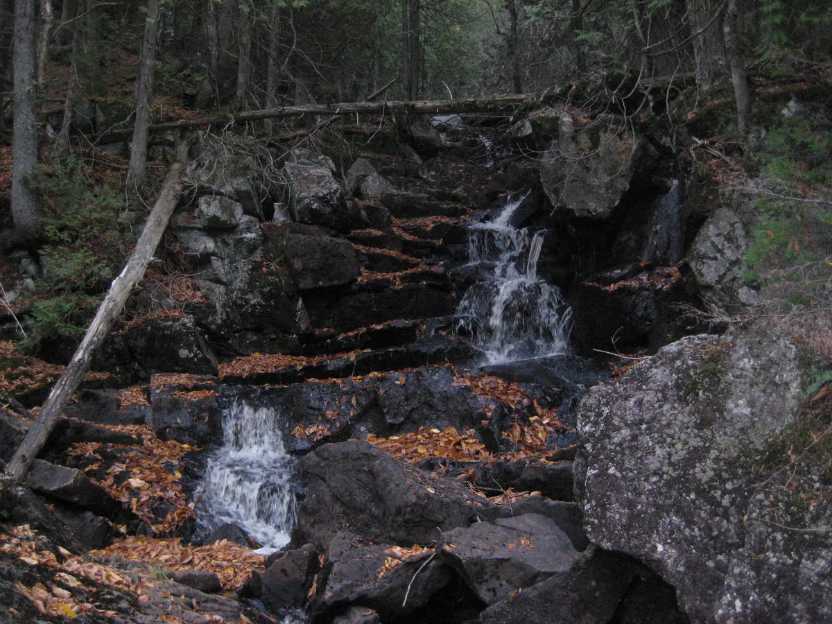 Small cascades over dark rock