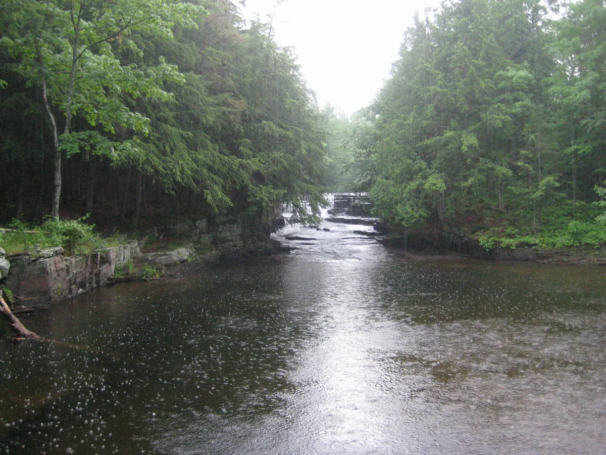 Looking across the rainy pool