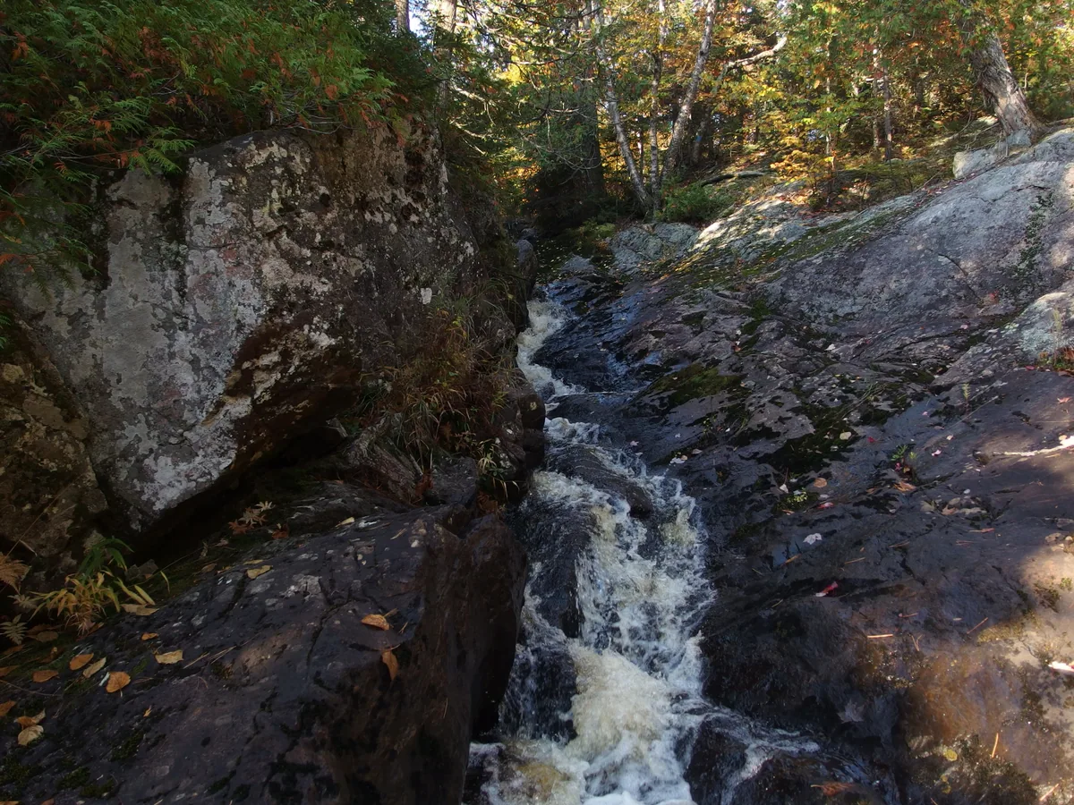Thin channel squeezing the river down
