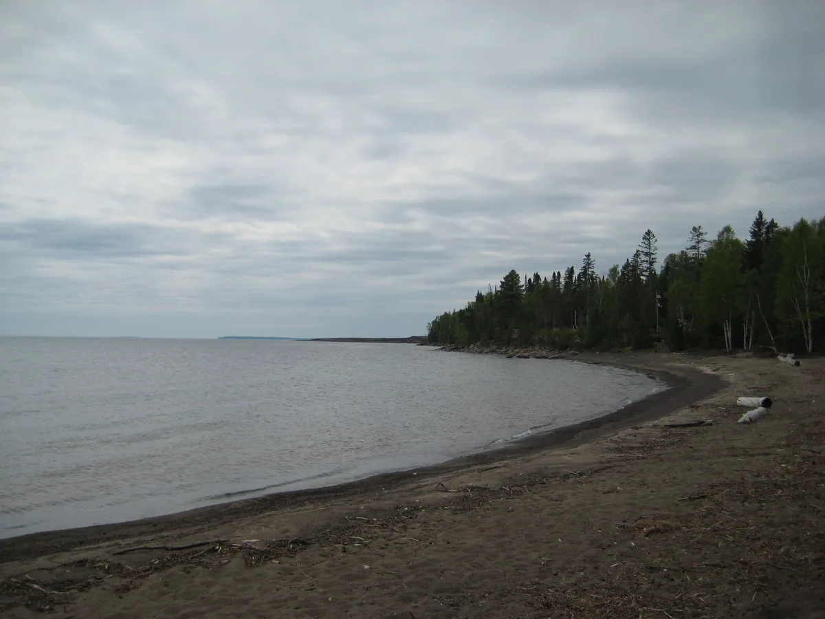 Stamp sand shore stretching south to Gay