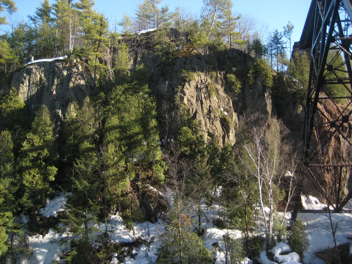 Steep cliffs to the south