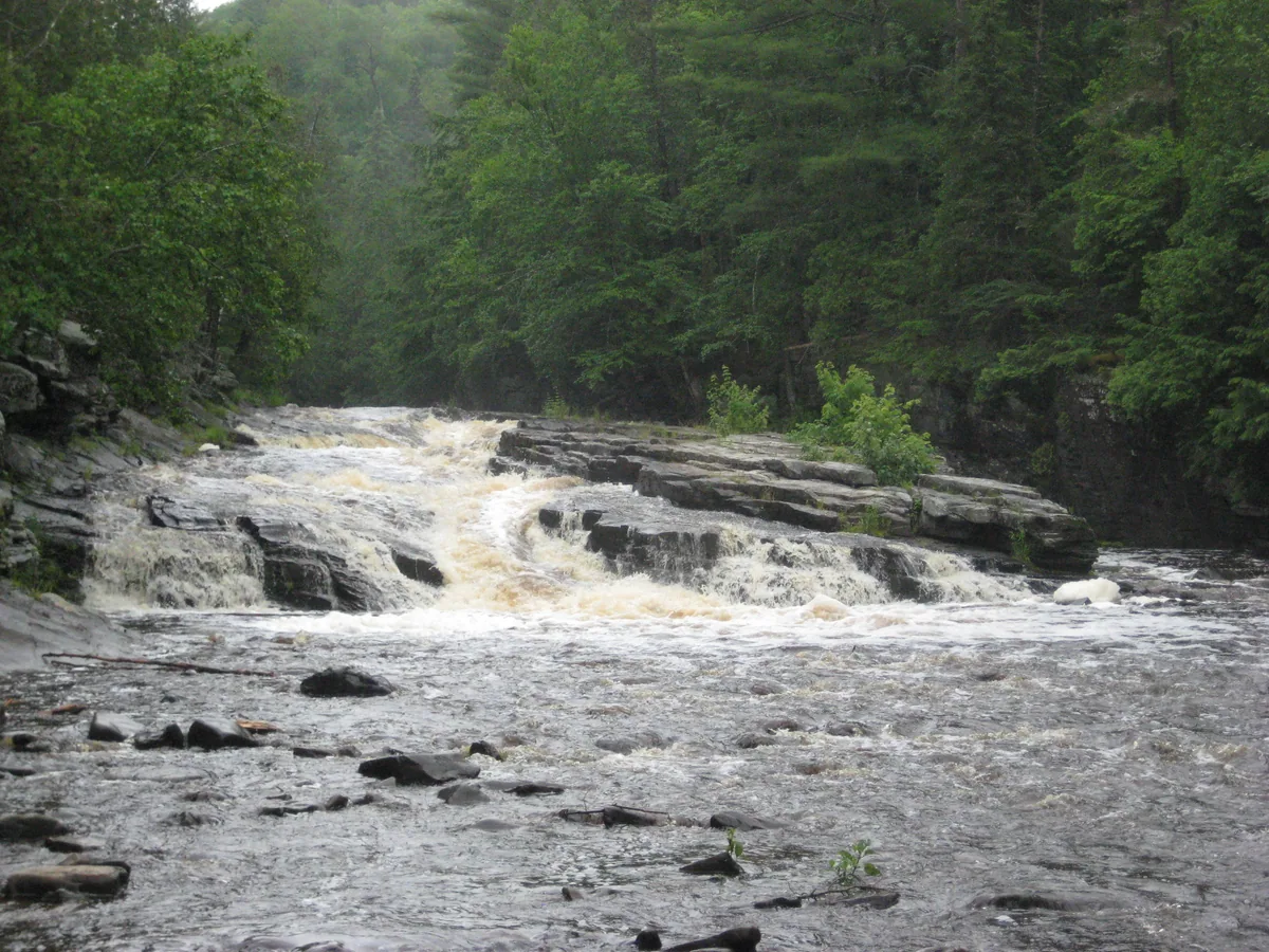 River dashing out of the canyon above