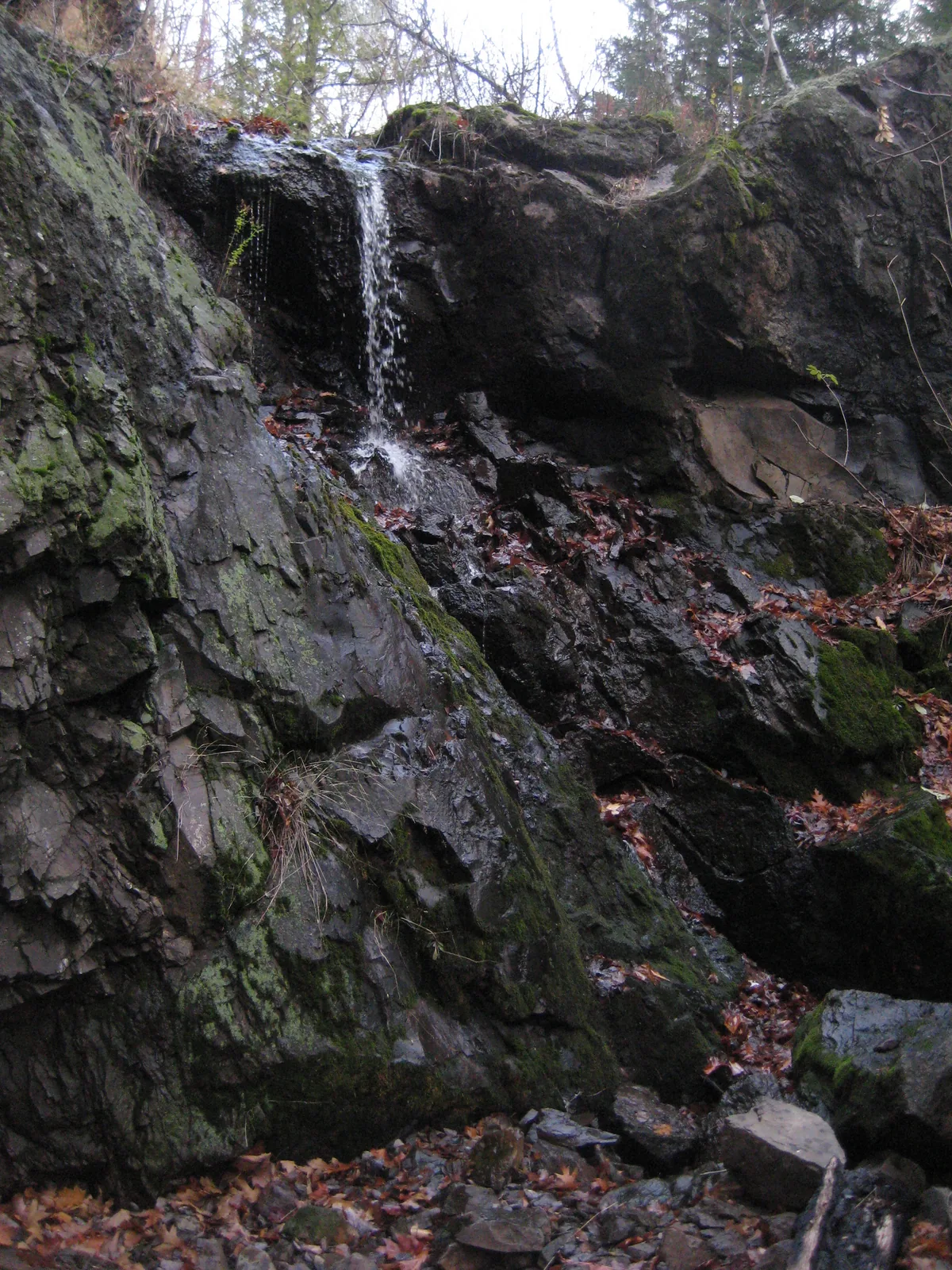 Large rocks around the trickling drop