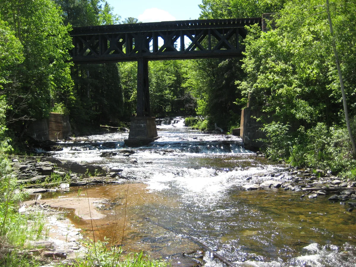 The falls beyond the older railroad bridge