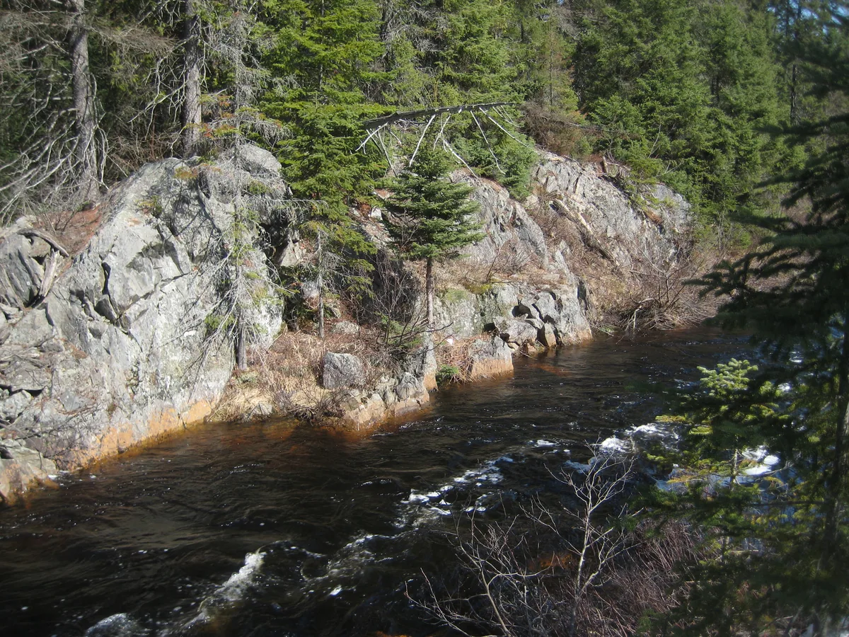 Rock walls stained by the tainted waters