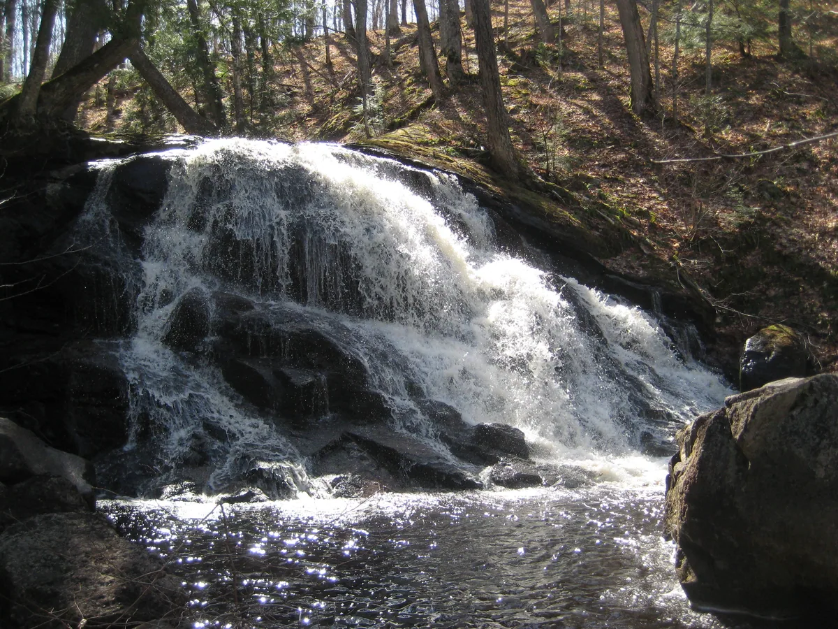 Clear water flowing over the rock dome